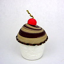 mocha frosting with a cherry on top cupcake