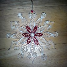 quilled snowflake in white with red accents
