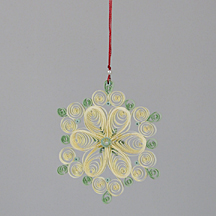 green and cream quilled snowflake