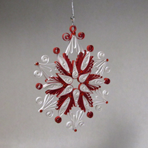 red and white quilled snowflake
