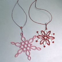 quilled ring snowflakes red and pink
